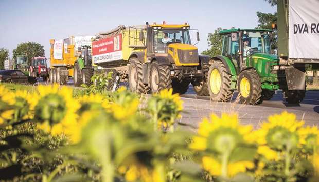 Slovak farmers drive their tractors near Senec, 30km from Bratislava, after crossing the country in protest against irregularities in farm subsidy payments.