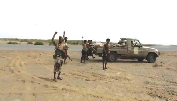 Armed members of coalition-backed Yemeni forces are seen near the airport on the outskirts of Hodeidah,, yesterday in this still image taken from video.