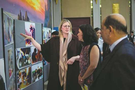 Deputy executive director for the United Nations Childrenu2019s Fund (Unicef), Shanelle Marie Hall (left), looks at pictures displayed at the launch of findings from the agencyu2019s u201cMultiple Indicator Cluster Surveysu201d (MICS) on North Korea, at the Taedonggang Diplomatic Club in Pyongyang.