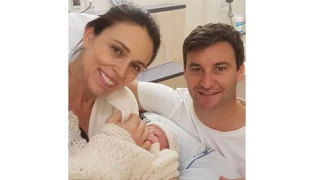 New Zealand Prime Minister Jacinda Ardern and her partner Clarke Gayford posing with their newborn baby girl at Auckland City Hospital.
