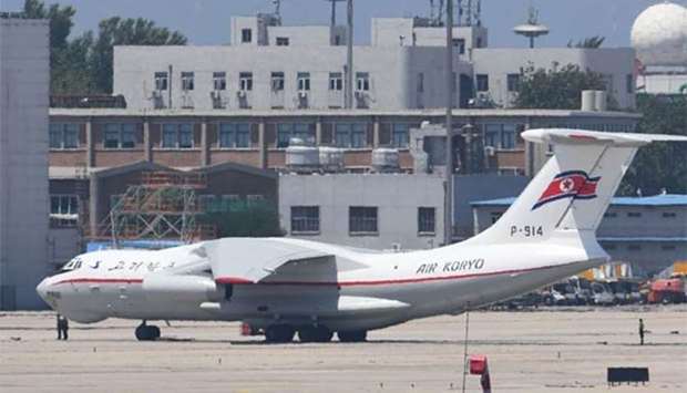 Paramilitary police stand guard beside a North Korean Air Koryo Il-76 transport aircraft parked near the VIP terminal at Beijing airport on Wednesday.