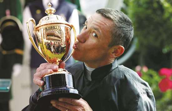 Frankie Dettori celebrates with the trophy after winning the 4.20 Gold Cup riding Stradivarius at the Royal Ascot yesterday. (Reuters)