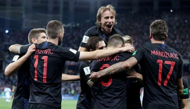 Croatia's Ivan Rakitic celebrates scoring their third goal with teammates