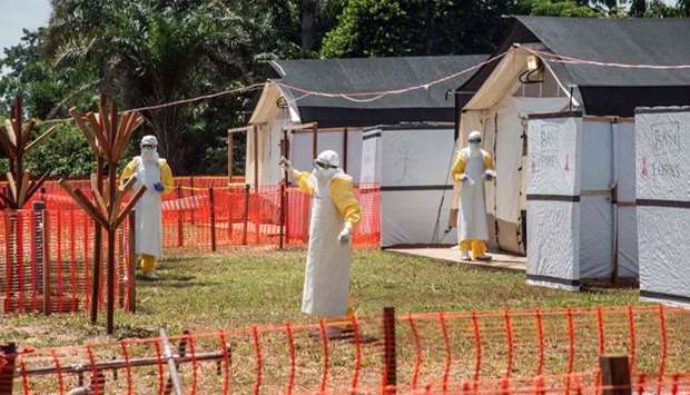 Health workers operate within an Ebola safety zone in the Health Center in Iyonda, near Mbandaka