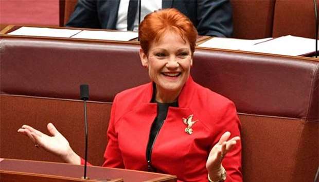 One Nation leader Senator Pauline Hanson gestures before the income tax vote in the Senate Chamber at Parliament House in Canberra on Thursday.
