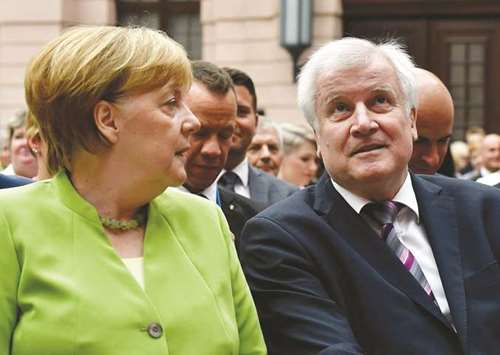 German Chancellor Angela Merkel and German Interior Minister Horst Seehofer attend an event on the occasion of the World Refugee Day yesterday at the German Historical Museum in Berlin. The World Refugee Day is being observed on June 20 each year, and the United Nations, the United Nations Refugee Agency (UNHCR) and civil groups around the world host events in order to dedicate raising awareness to people who are forced to flee their homes and seek safety elsewhere.