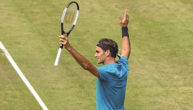 Roger Federer celebrates after defeating Matthew Ebden in the ATP tennis tournament in Halle, western Germany, yesterday. (AFP)