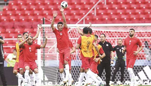 Tunisiau2019s Ahmed Khalil jumps for a ball next to teammates during a training session at the Spartak Stadium in Moscow yesterday.