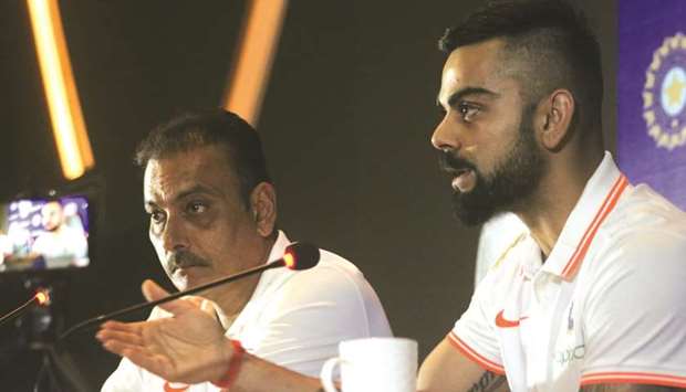 Indian captain Virat Kohli (right) and coach Ravi Shastri address a press conference before leaving for England and Ireland in New Delhi yesterday. (IANS)