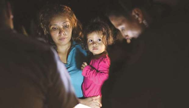 This picture, also taken by John Moore on June 12, shows Hondurans Sandra Sanchez with her two-year-old daughter Yanela Denise, who were stopped and taken into custody at the border in McAllen, Texas.