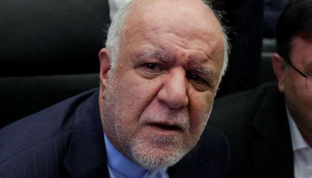 Iran's Oil Minister Bijan Zanganeh talks to journalists at the beginning of an OPEC meeting yesterday in Vienna, Austria