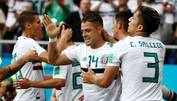 Mexico's Javier Hernandez celebrates scoring their second goal with Carlos Salcedo and team mates
