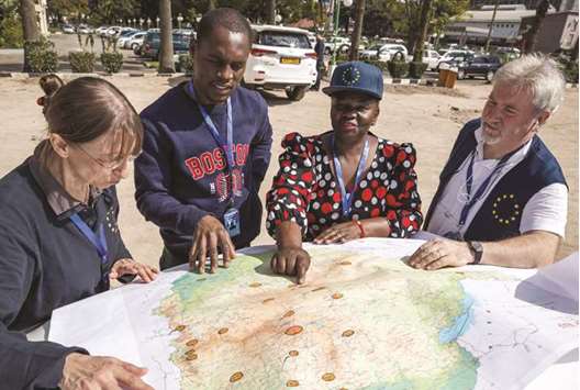 Observers study a map upon arrival of the European Union Election Observation Mission in Harare yesterday.