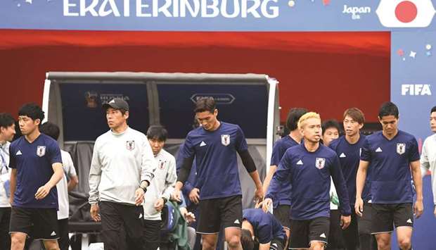 Japanu2019s coach Akira Nishino (second from left) and his players attend a training session in Yekaterinburg yesterday. (AFP)