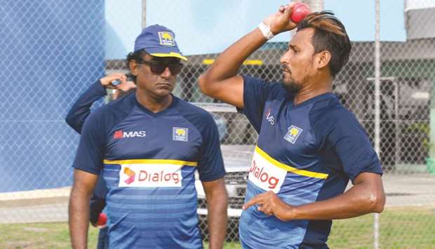 Suranga Lakmal (right) of Sri Lanka takes part in a training session under the watchful eye of Rumesh Ratnayake (left) one day before the 3rd Test against West Indies at Kensington Oval, Bridgetown, Barbados, yesterday. (AFP)