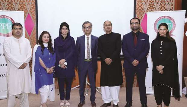 GROUP: Dr Muhammed Aasim Yusuf, Chief Medical Officer of SKMCH, centre, and Naila Khan, Associate Director Marketing of SKMCH, third left, with the organisers and other dignitaries.