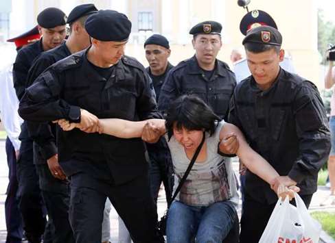 Officers detain an activist during a rally yesterday in Almaty.