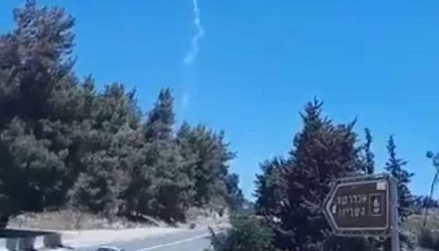 Image grab from a video posted on social media showing the path of the missile fired by Israel.