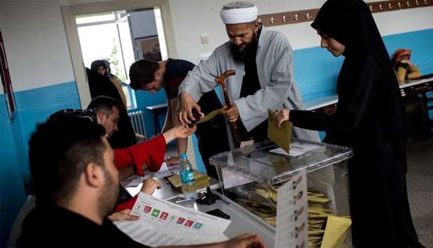 People vote in snap twin Turkish presidential and parliamentary elections in Istanbul