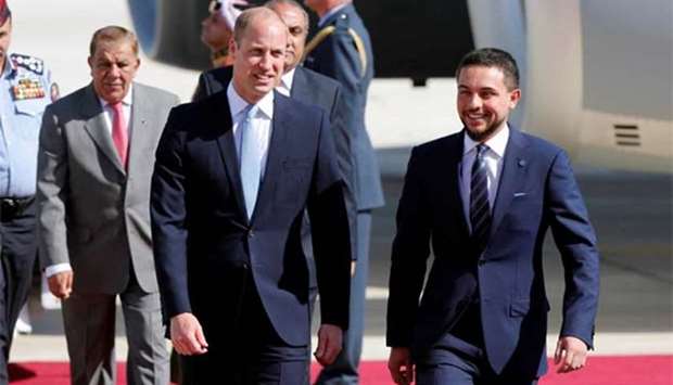 Prince William is welcomed by Crown Prince Hussein bin Abdullah II in Amman on Sunday.