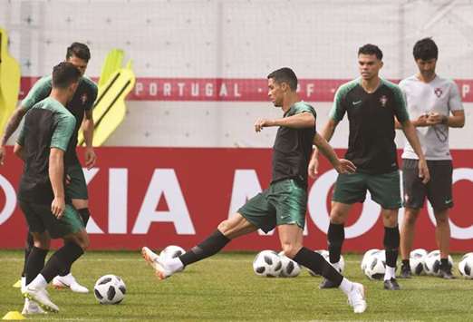 Portugalu2019s Cristiano Ronaldo and teammates attend a training session at the teamu2019s base in Kratovo, outside Moscow, Russia, yesterday. (AFP)