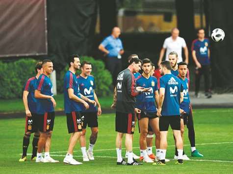 Spainu2019s coach Fernando Hierro (centre) speaks with defender Nacho Fernandez (third from right) during a training session in Krasnodar, Russia. (AFP)