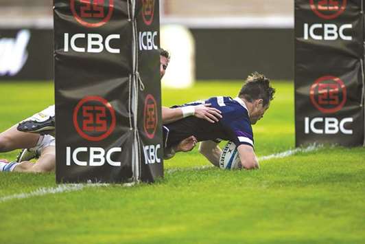 George Horne from Scotland scores a try during their Test match against Argentina at the Centenario stadium, in Resistencia, Chaco province, Argentina. (AFP)