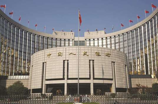 The Peopleu2019s Bank of China headquarters in Beijing. The PBoC said yesterday it would cut the amount of cash that some banks must hold as reserves by 50 basis points,  releasing $108bn in liquidity, to accelerate the pace of debt-for-equity swaps and spur lending to smaller firms.