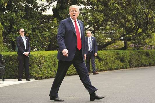 US President Donald Trump walks to Marine One as he departs for Cleveland, Ohio, from the South Lawn of the White House in Washington on May 5, 2018. The escalating trade battle between the US and the rest of the world is raising the risk of a meaningful slowing in an otherwise vibrant American economy.