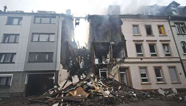 Debris of the house that exploded in the night is seen on the street in Wuppertal, western Germany.