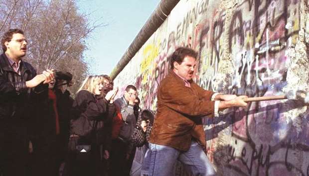 In November 1989 East Germans flooded the border, and joined by West Berliners on the other side, tore the wall apart with whatever tools they could find.