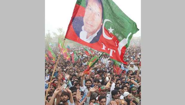 Supporters of former Pakistani cricketer-turned-politician Imran Khan participate in an election campaign in Mianwali, some 240km southwest of Islamabad, yesterday. The Pakistan Tehreek-e-Insaf (PTI) chief kicked off his election campaign by staging a major rally and promising sweeping changes in the country if his party wins the elections.