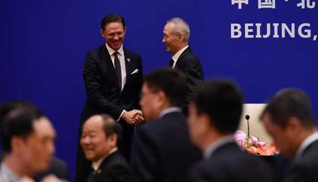 European Commission Vice President Jyrki Katainen (L) shakes hands with China's Vice Premier Liu He following their joint press conference during the EU-China High-level Economic Dialogue at the Diaoyutai State Guesthouse in Beijing.