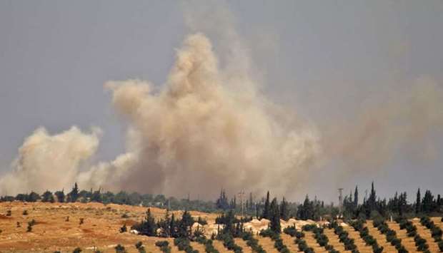 Smoke rises above opposition held areas of Daraa during an airstrike by Syrian regime forces.