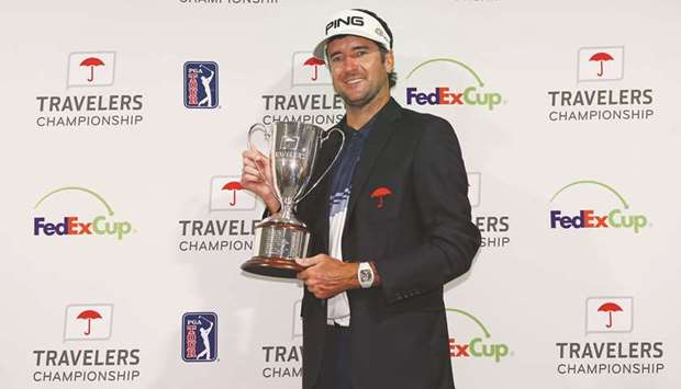 Bubba Watson poses with the trophy after winning the Travelers Championship at TPC River Highlands in Cromwell, Connecticut. (Getty Images/AFP)