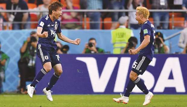 Japanu2019s midfielder Takashi Inui (left) celebrates after scoring a goal during the Group H match against Senegal at the Ekaterinburg Arena in Ekaterinburg, Russia, on Sunday. (AFP)