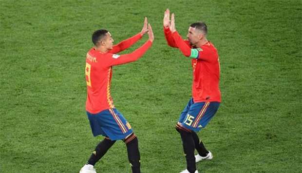 Spain's forward Rodrigo and defender Sergio Ramos celebrate their second goal against Morocco at the Kaliningrad Stadium in Kaliningrad on Monday.