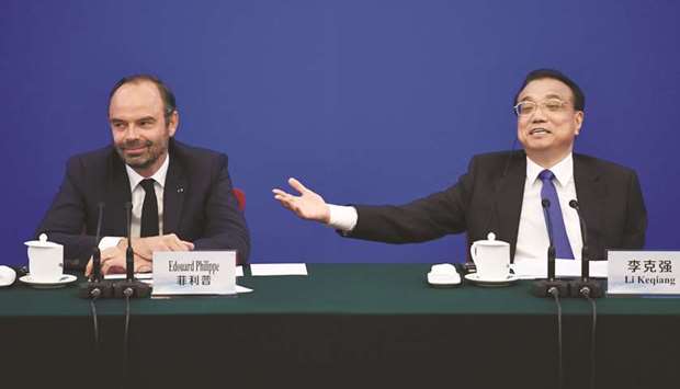 Chinese Premier Li Keqiang speaks during a meeting with French Prime Minister Edouard Philippe at the Great Hall of the People in Beijing yesterday. Li told Philippe late yesterday that China was planning to purchase more planes this year and was ready for more talks with France on buying Airbus aircraft.