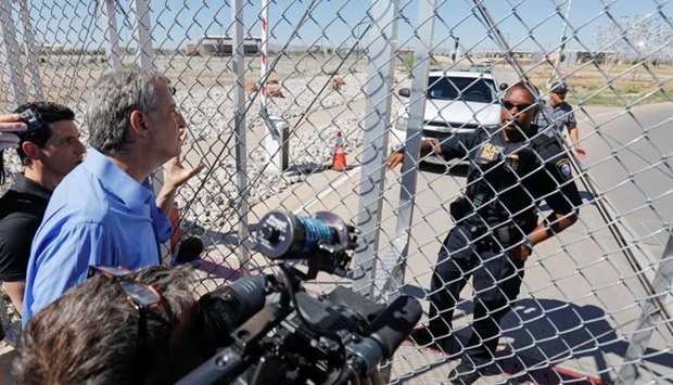 New York mayor Bill De Blasio speaks to a DHS officer through a chain linked fence outside of the children's tent encampment built to deal with the Trump administrations ,zero tolerance, policy in Tornillo, Texas.