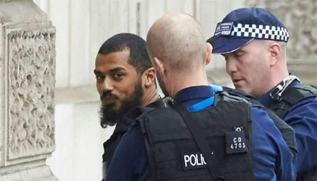 British police detain a man, later named as Khalid Mohammed Omar Ali, on Whitehall near the Houses of Parliament in London in April last year. File picture