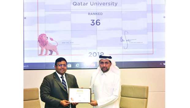 Dr Hassan al-Derham receiving the ranking certificate from QS official Ashwin Fernandesrnrn