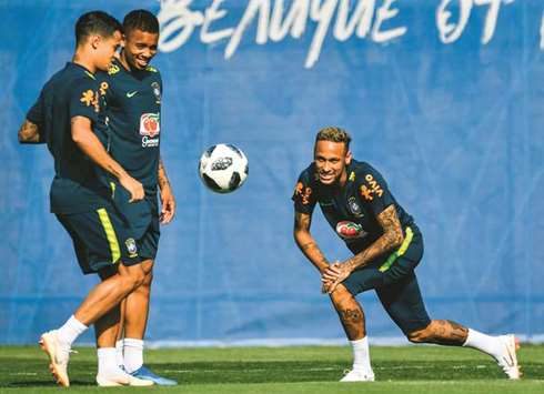 Brazilu2019s Neymar (right), Philippe Coutinho (left) and Gabriel Jesus take part in a training session yesterday. (AFP)