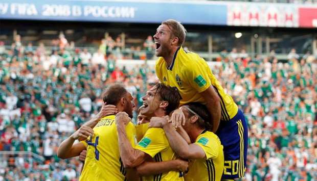 Sweden's Andreas Granqvist celebrates scoring their second goal with team mates