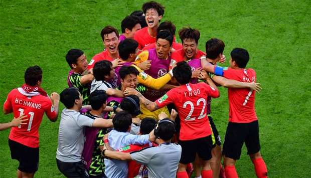South Korea's players celebrate their goal during the Russia 2018 World Cup Group F football match between South Korea and Germany