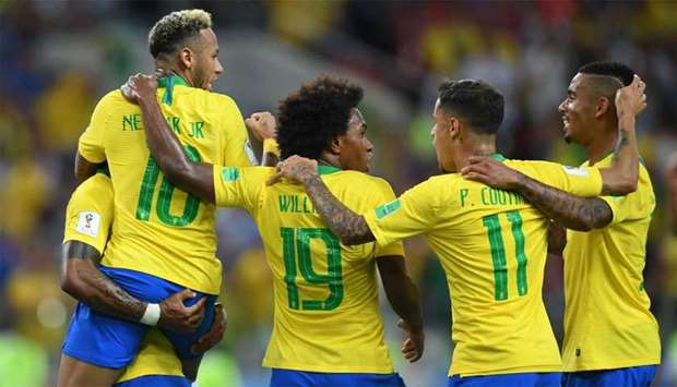 Brazil players celebrate their opening goal during the Russia 2018 World Cup Group E football match between Serbia and Brazil