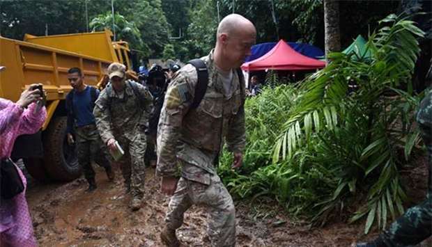 US military personnel arrive at Khun Nam Nang Non Forest Park near Than Luang cave in Chiang Rai province on Thursday to assist in rescue operation for a missing children's football team and their coach.