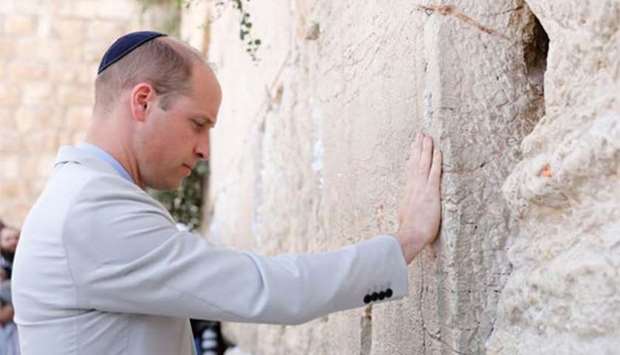 Prince William touches the Western Wall in Jerusalem's Old City on Thursday.
