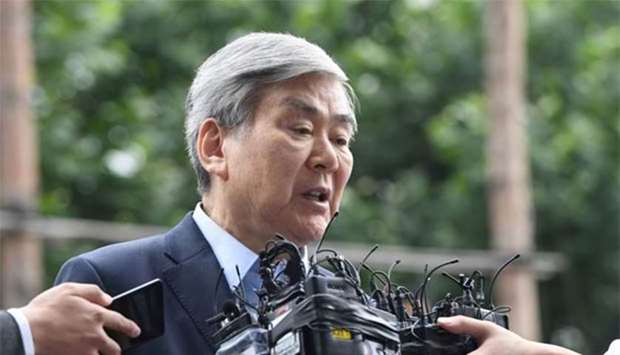 Korean Air chairman Cho Yang-ho speaks to the media as he arrives at the Seoul Southern District Prosecutors' Office for questioning over suspected tax evasion, in Seoul on Thursday.
