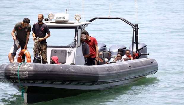 Migrants who survived the sinking of an inflatable dinghy boat off of the coast of Libya are brought ashore in al-Hmidiya, east of the capital Tripoli.