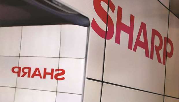 A logo of Sharp is seen at Combined Exhibition of Advanced Technologies at the Makuhari Messe in Chiba, Japan. u201cDue to increasing market uncertainties, the company decided that carrying on with the plan to issue new shares would not yield maximum benefit for shareholders,u201d Sharp said.